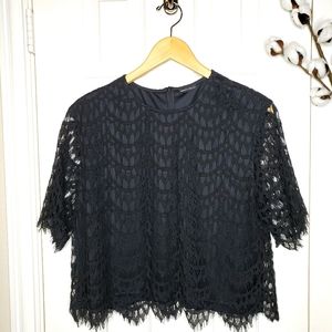 Short sleeve black lace crop top.